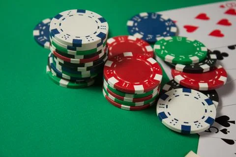 Classic playing cards, chips, red dice and dollars on green background. Gambl Stock Photos