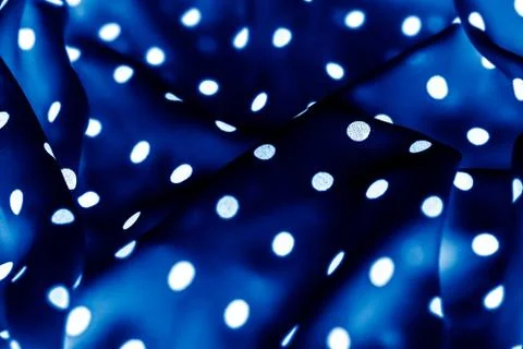 Classic polka dot textile background texture, white dots on blue luxury fabri Stockfoto's