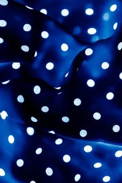 Classic polka dot textile background texture, white dots on blue luxury fabri Stock Photos