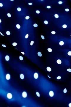 Classic polka dot textile background texture, white dots on blue luxury fabri Stock Photos