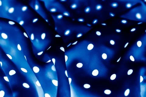 Classic polka dot textile background texture, white dots on blue luxury fabri Stockfoto's