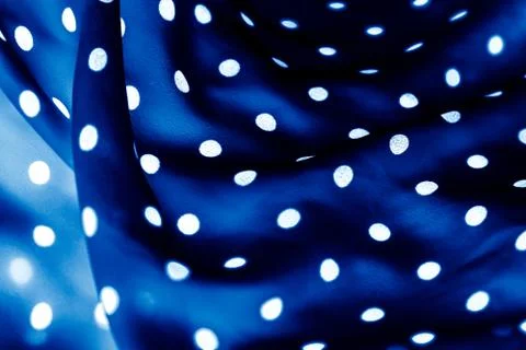 Classic polka dot textile background texture, white dots on blue luxury fabri Stock Photos