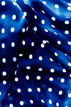 Classic polka dot textile background texture, white dots on blue luxury fabri Stockfoto's