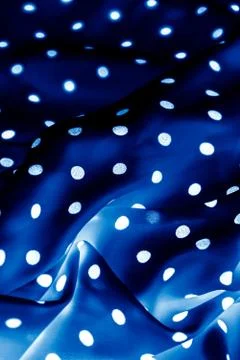 Classic polka dot textile background texture, white dots on blue luxury fabri Stock Photos