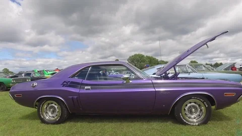 Classic purple dodge challenger side view swoop into engien bay gimbal 4k Stock Footage