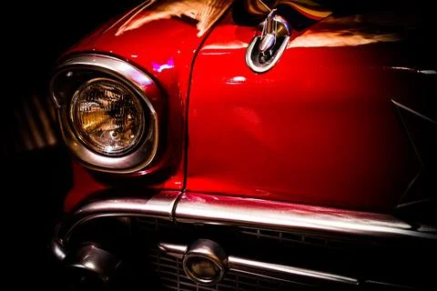 A classic red car floating in the darkness Stock Photos
