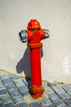 Classic red fire hydrant on a taratuar Stock Photos