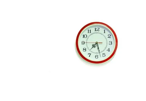 Classic red round wall clock / watch wall clock isolated on white background Foto stock