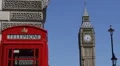 Classic Red Telephone Box Closeup London Skyline Elizabeth Tower Clock Sunny Day HD Footage