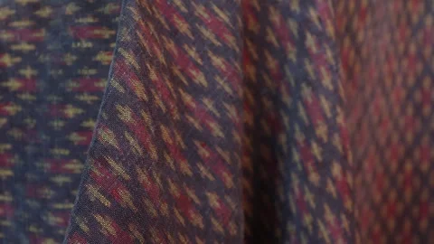 Classic red Thai fabric pattern in natural light, texture background Stock Footage 296731688