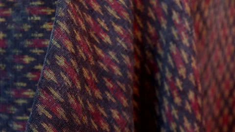 Classic red Thai fabric pattern in natural light, texture background Stock Footage 296731900