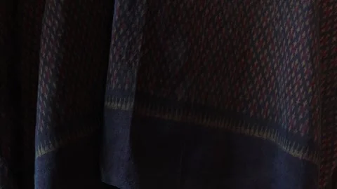 Classic red Thai fabric pattern in natural light, texture background Stock Footage 296734635
