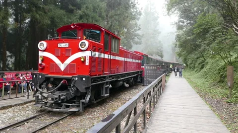 Classic Red Train Moving from forest station in the high mountain. Stock Footage 58482851