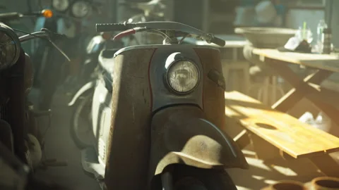 Classic retro rusty scooter parked under a metal sheet awning shade. Stock Footage 330953498