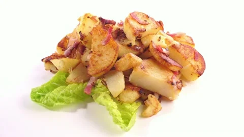 Classic Roasted Potatoes with Bacon and Onions on white Background Stock Footage 221642401