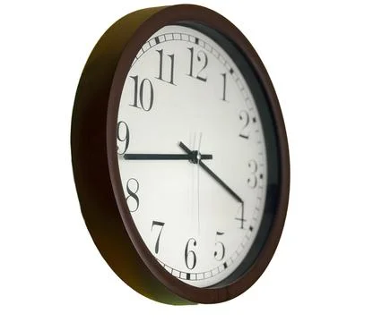 Classic Round Wall Clock With White Face Isolated Stock Photos