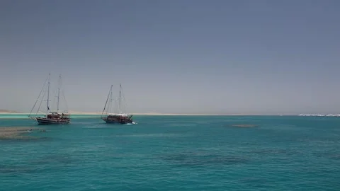 Classic sailing yachts anchored in tranquil blue water vintage wood details soft Stock Footage 310819253