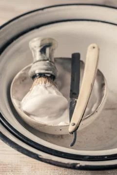 Classic shaving set. Sharp razor, soap and brush Stock Photos