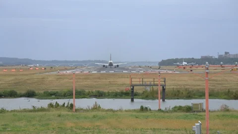 Classic shot of distant Jumbo Jet takes off at Reagan National Airport. Stock Footage 126992577