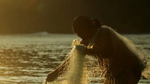 Classic shot of Polynesian fisherman throwing net. Stock Footage