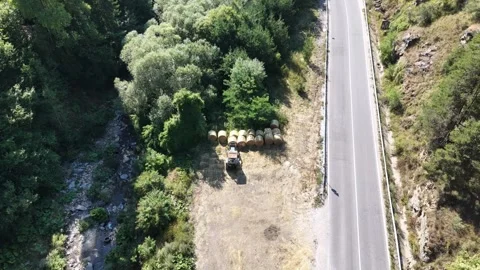 Classic Soviet Russian Tractor Parked with Round Hay Bales Aerial Shot Video stock 343618118