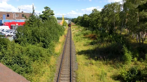 Classic steam train producing smoke travelling through countryside Stock Footage 80313264