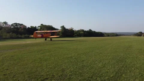 Classic Stearman Biplane Taking Flight in San Bernardino, Paraguay Stock Footage 239923280