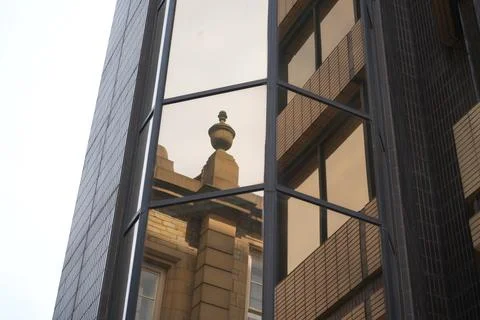 Classic Stone Building Finial Reflected In Modern Glass Facade Sheffield England Stock Photos