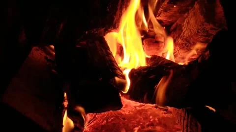 Classic stone fireplace with a bright flame burning wood Stock Footage 172442765
