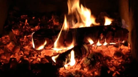 Classic stone fireplace with a bright flame burning wood Stock Footage 172442790