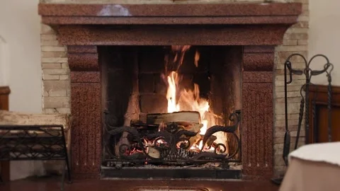Classic stone fireplace with a fire Stock Footage 232810083