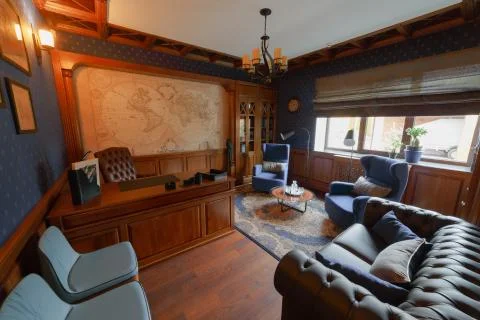 Classic study with a large oak desk. Stock Photos
