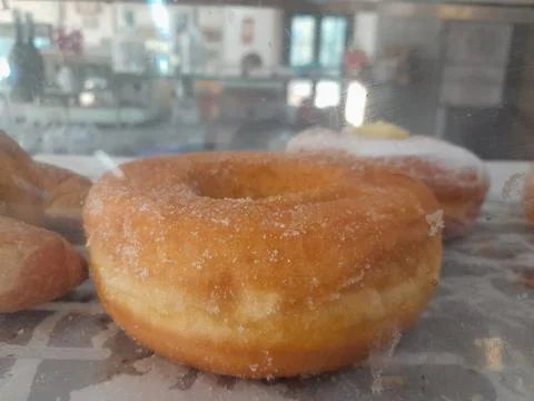 Classic sugar coated fried doughnut delicious snack food Фото