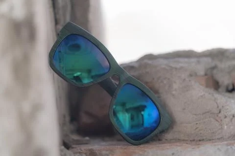 Classic sunglasses model shoot in creative indoor place closeup. Selective focus Stock Photos