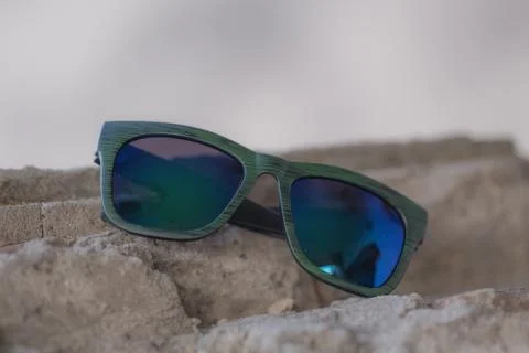 Classic sunglasses model shoot in creative indoor place closeup. Selective focus Stock Photos
