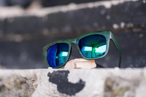 Classic sunglasses model shoot in creative indoor place closeup. Selective focus Stock Photos