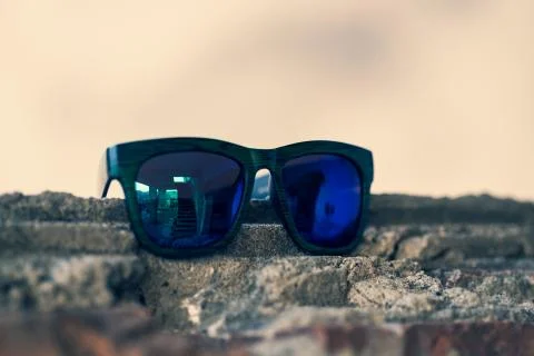 Classic sunglasses model shoot in creative indoor place closeup. Selective focus Stock Photos