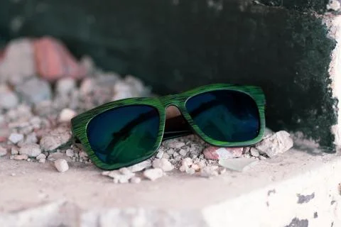 Classic sunglasses model shoot in creative indoor place closeup. Selective focus Stock Photos