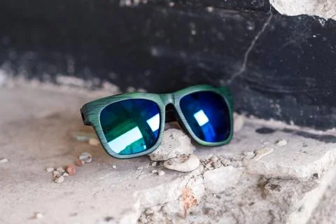 Classic sunglasses model shoot in creative indoor place closeup. Selective focus Stock Photos