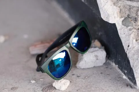 Classic sunglasses model shoot in creative indoor place closeup. Selective focus Stock Photos