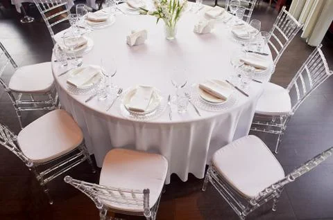 Classic table setting. White tablecloth, glasses, knife and fork. Ease.Round Stock Photos