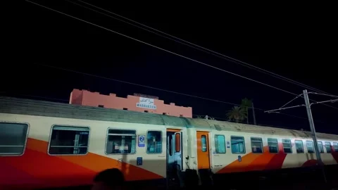 Classic Train At Marrakech Station Under Night Sky With Overhead Wires Stock Footage 302905929