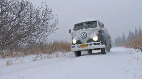 Classic VW Bus Van Drive By in Blizzard Stock Footage 8951639
