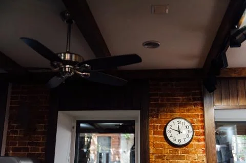 Classic Wall Clock on a Brick Wall Stock Photos