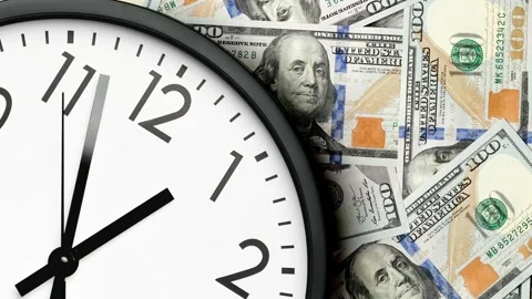 Classic wall clock on dollar banknotes. Clock running fast. Time is money. Video stock 297254800