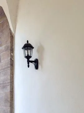 Classic Wall Mounted Lantern Light on Stone Wall Fotos de archivo