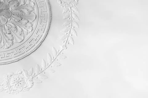 Classic white plaster ceiling medallion with decorative floral molding Stock Photos