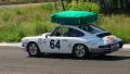 Classic white Porsche 911 traveling with luggage on roof HD Footage