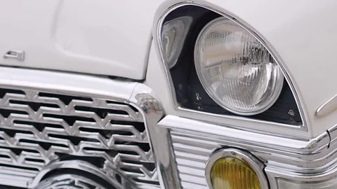 Classic white retro machine. headlights close-up. slow motion Stock-Footage 80362139