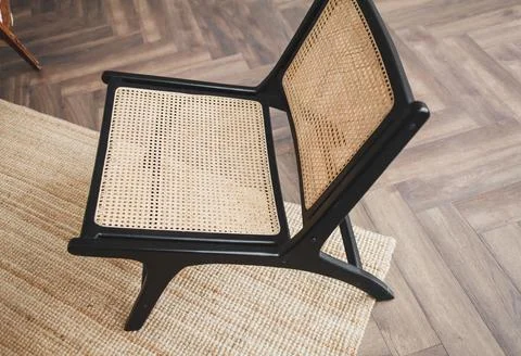 Classic wicker in a stylish interior Stock Photos